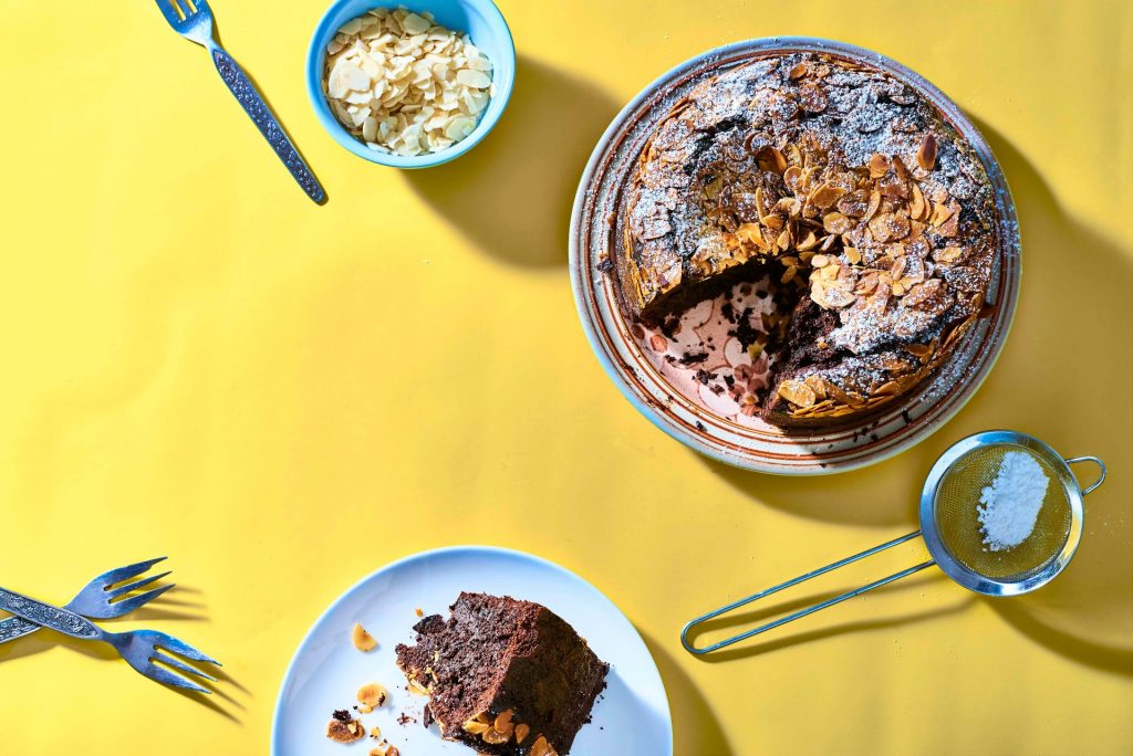 Gluten-free fudgy chocolate cake with toasted almonds