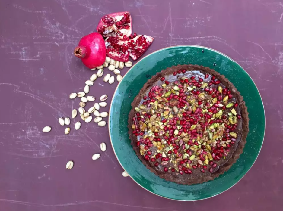 Dark chocolate tart with pomegranate and pistachios